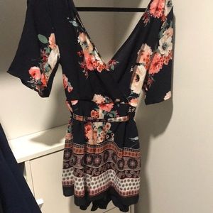 Cute navy floral romper with tie in back